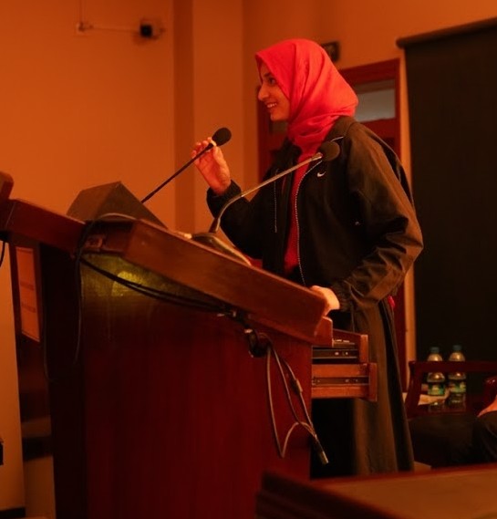 Speaking at podium